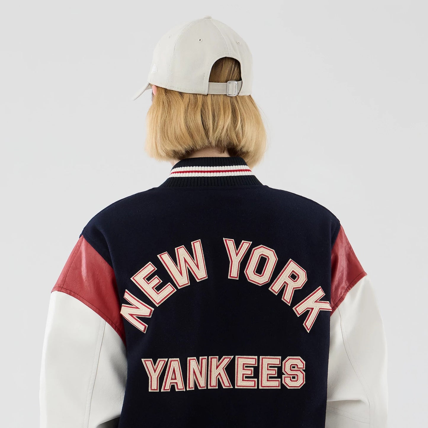 The model is wearing this MLB Varsity New York Yankees Jacket in navy. 8
