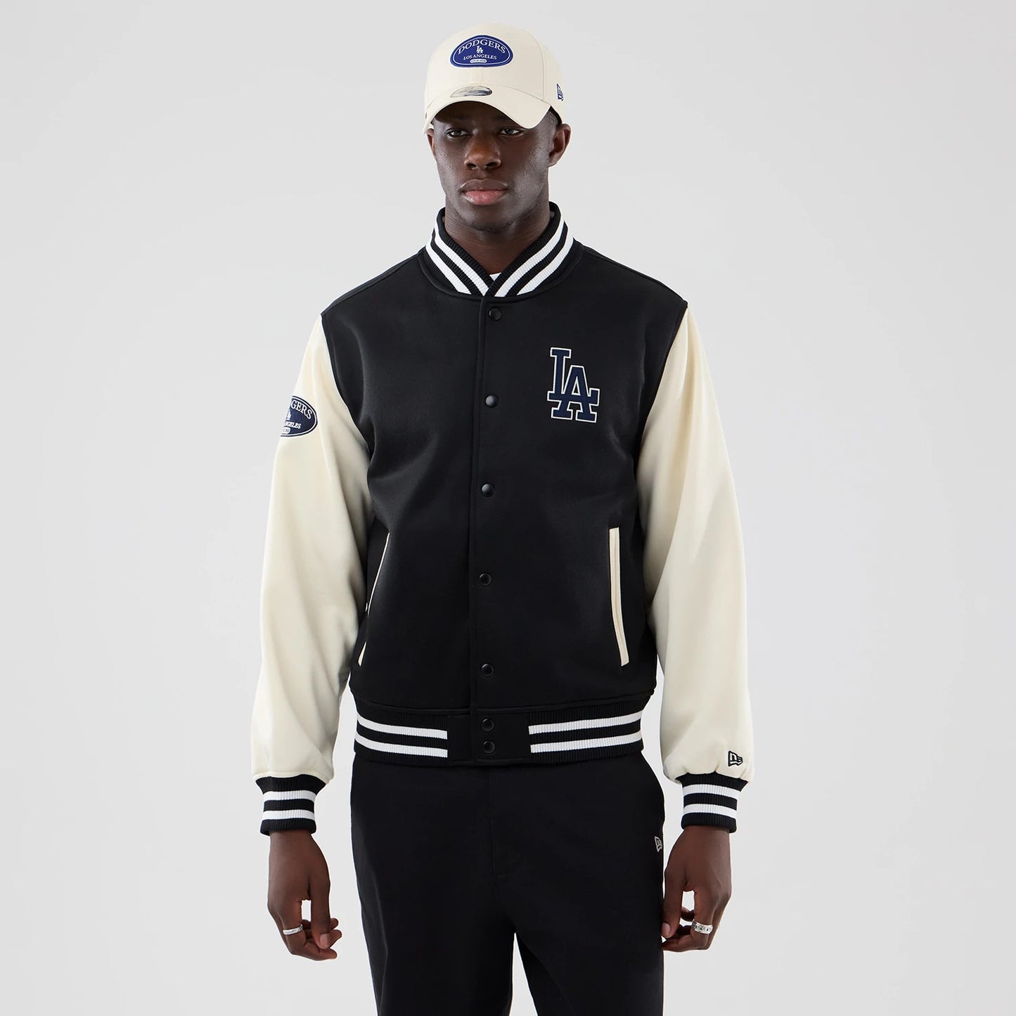 The model is wearing this MLB Jersey Bomber LA Dodgers Jacket in black. 3