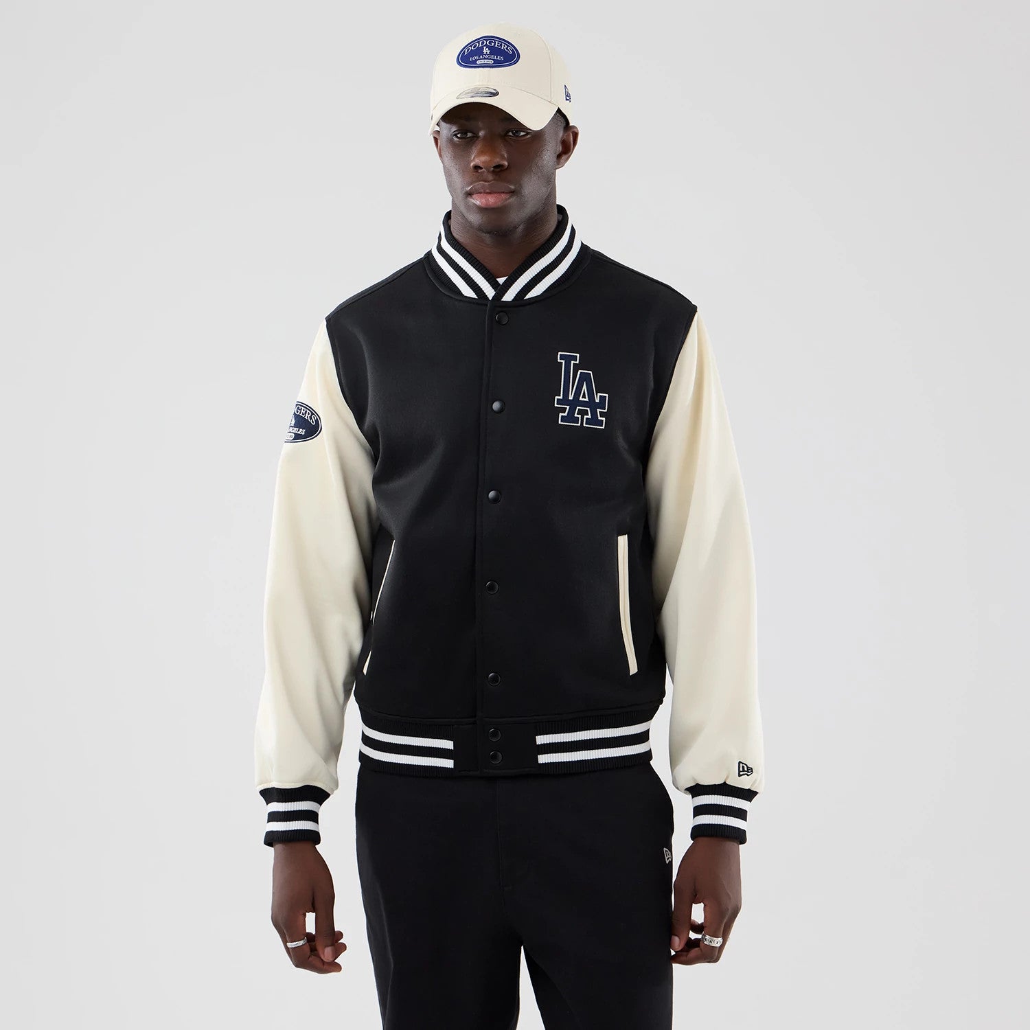 The model is wearing this MLB Jersey Bomber LA Dodgers Jacket in black. 3