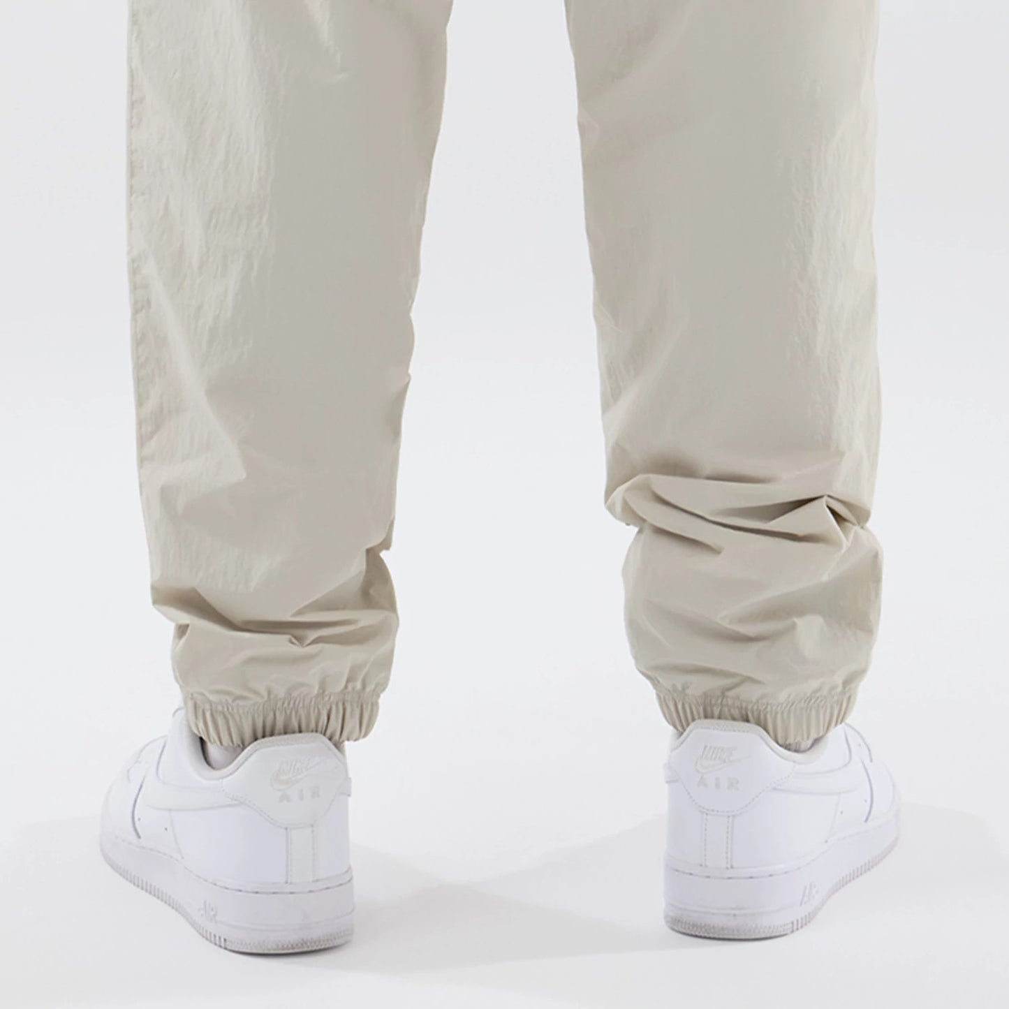 The model is wearing these MLB Piping Track New York Yankees Track Pants in cream. 7