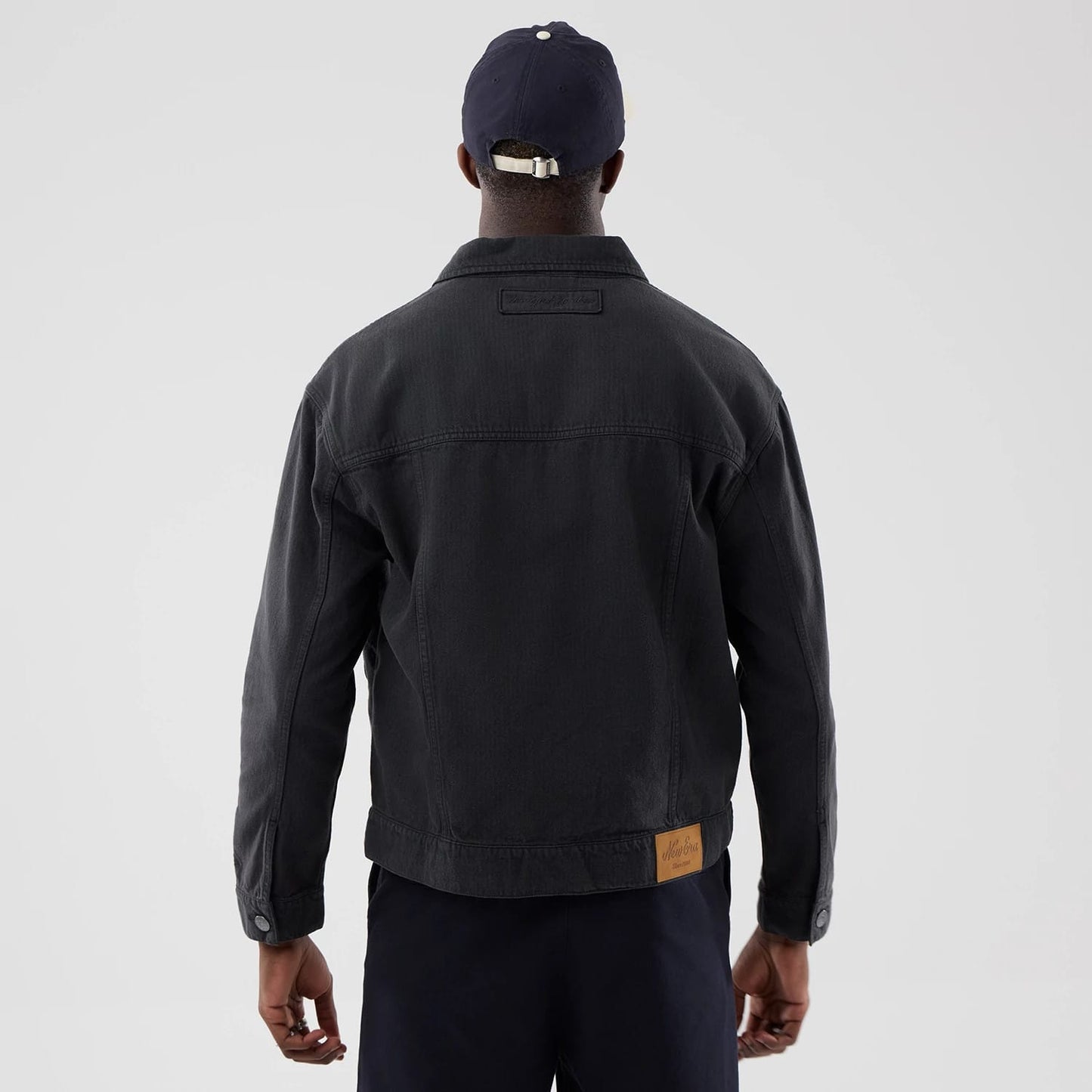 The model is wearing this MLB Stripe Denim New York Yankees Jacket in grey. 2