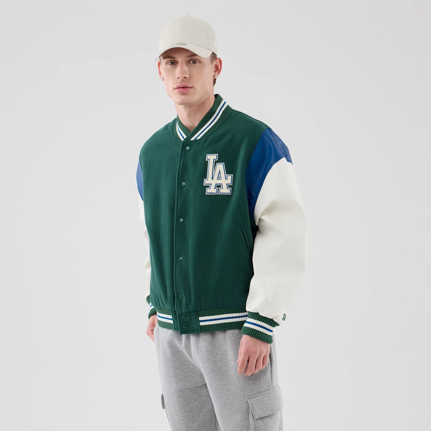 The model is wearing this MLB Varsity LA Dodgers Jacket in dark green. 3