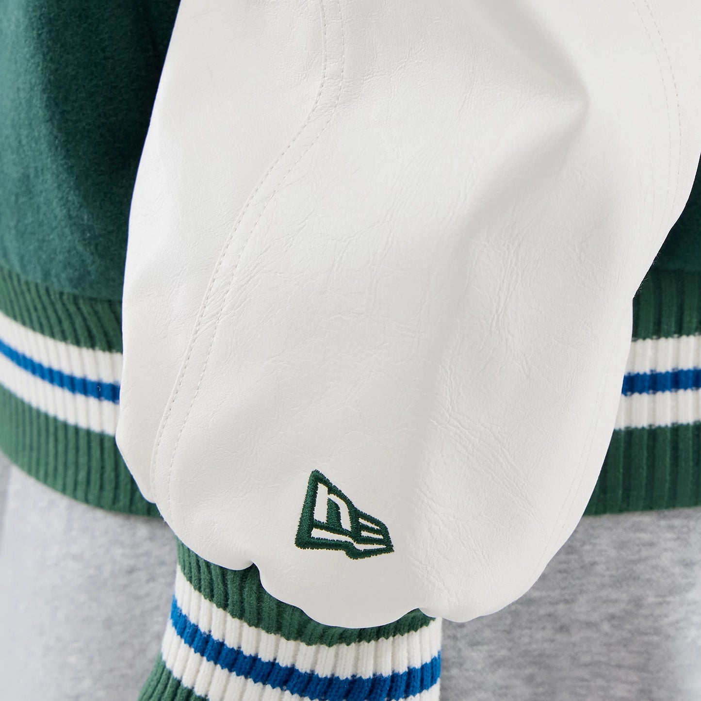 The model is wearing this MLB Varsity LA Dodgers Jacket in dark green. 7