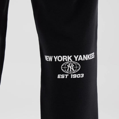 The model is wearing these MLB Logo Graphic New York Yankees Straight Leg Joggers in black. 6