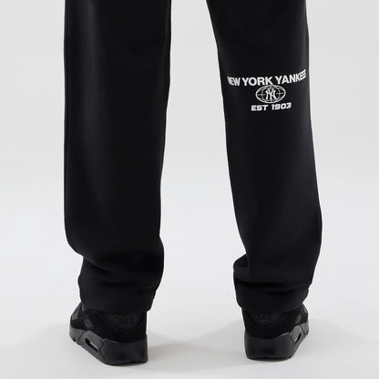 The model is wearing these MLB Logo Graphic New York Yankees Straight Leg Joggers in black. 7