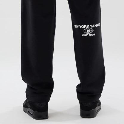 The model is wearing these MLB Logo Graphic New York Yankees Straight Leg Joggers in black. 7
