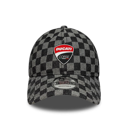 Ducati Motor All Over Print Black New Era 9TWENTY Adjustable Cap, front view showing the red and white Ducati Corse logo on the black and grey chequered front panel, with a curved visor and 9TWENTY size sticker.