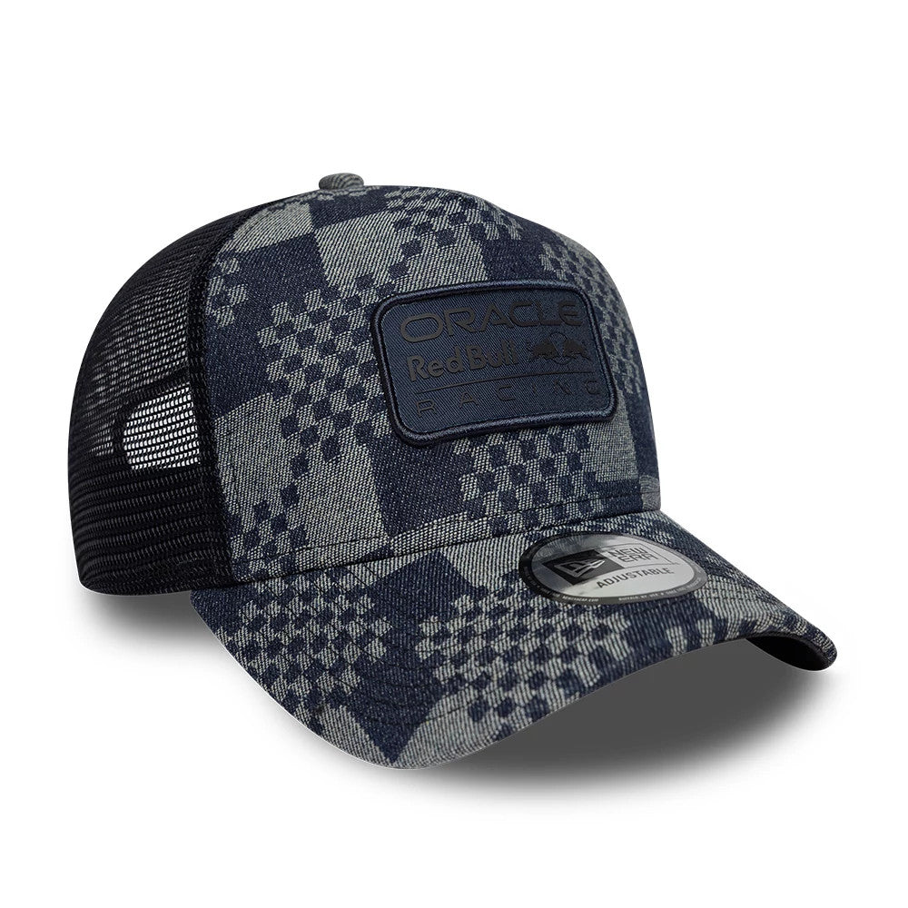 Red Bull Racing Patterned Denim Dark Blue New Era 9FORTY E-Frame Trucker Adjustable Cap, three-quarter view showing a dark woven patch with Oracle Red Bull Racing logo on the front panel, black mesh sides.