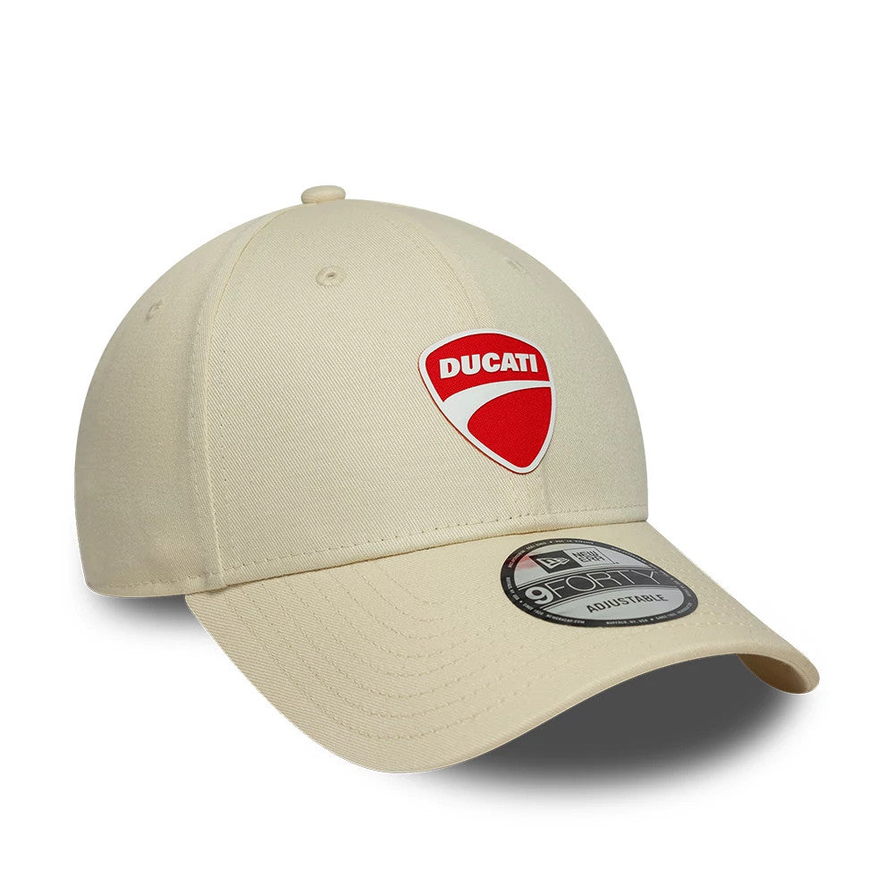Ducati Motor Core Cream New Era 9FORTY Adjustable Cap, three-quarter view showing the red and white Ducati logo in raised embroidery on the front panel, cream curved visor with a 9FORTY size sticker, and top button and eyelets.