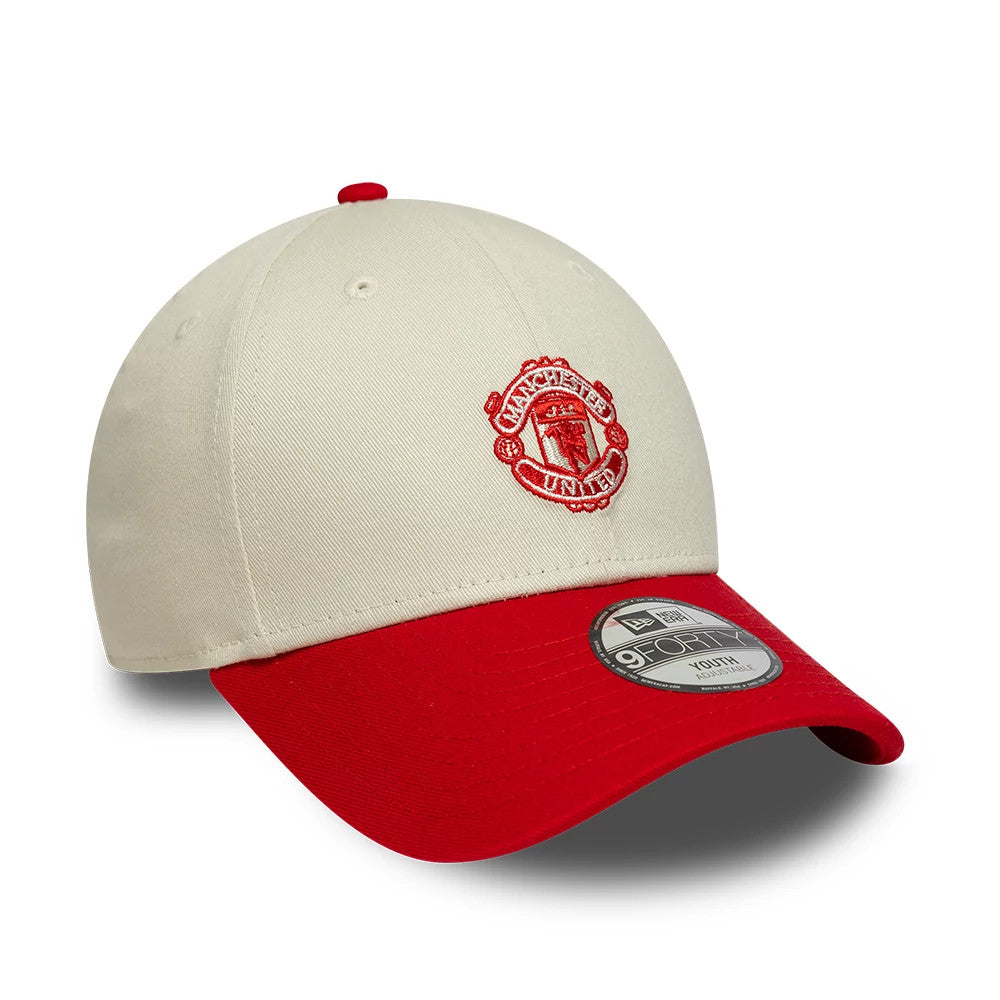 Pictured is this Youth Manchester United FC Contrast 9FORTY cap in cream. 3