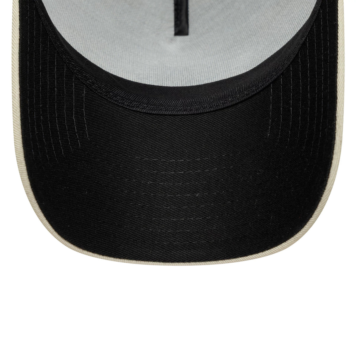 Aston Villa FC Cream New Era 9FORTY E-Frame Trucker Adjustable Cap, inside view showing a grey undervisor, black stitching across the black sweatband, and the black centre strip along the inner crown.
