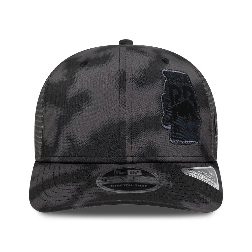 Visa Cash App Racing Bulls All Over Black New Era 9SEVENTY Stretch Snap Adjustable Cap, front view showing black embroidered Visa PBR logo on the front panel, black curved visor with a 9SEVENTY size sticker, and black mesh background.