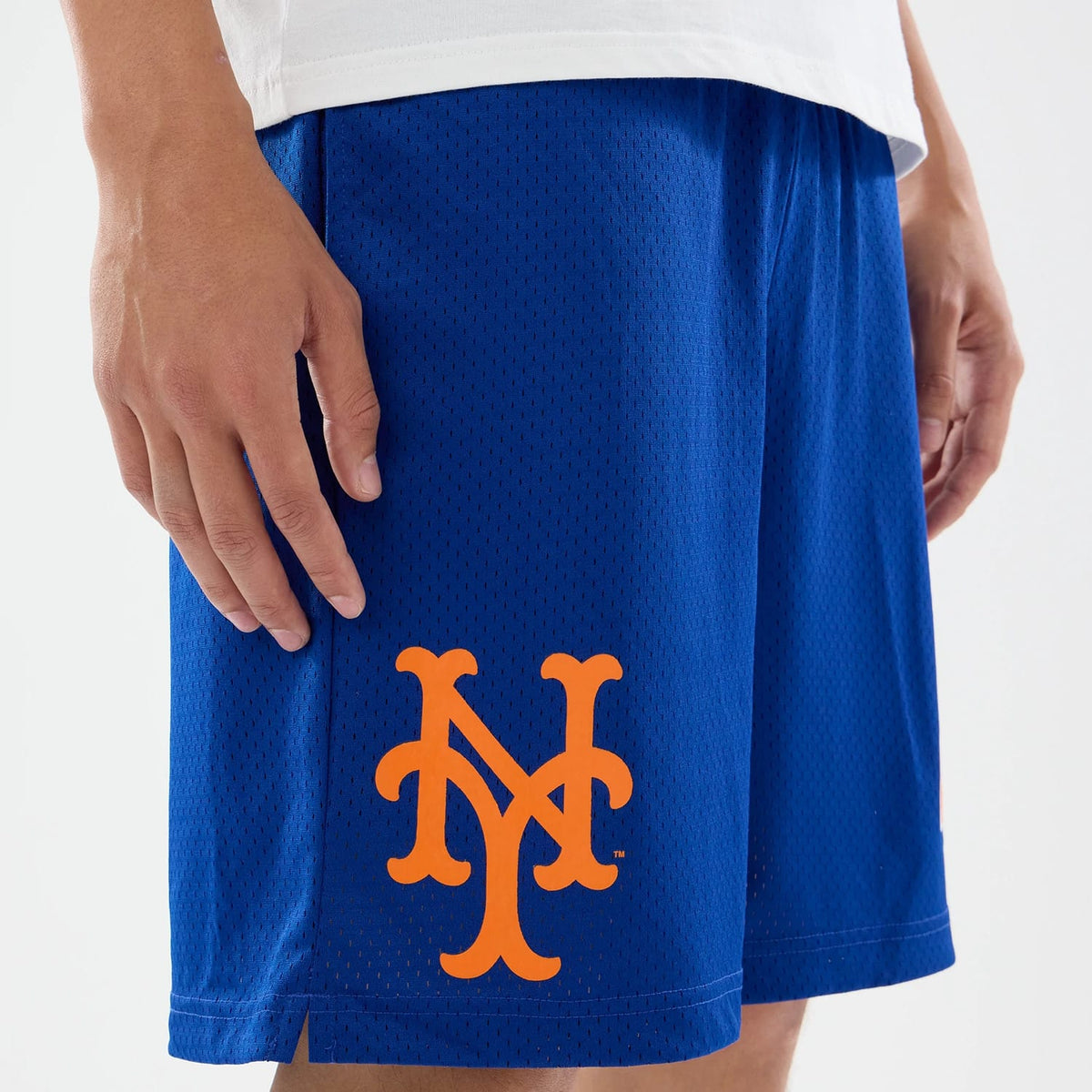 The model is wearing these MLB Evergreen New York Mets Shorts in blue. 5