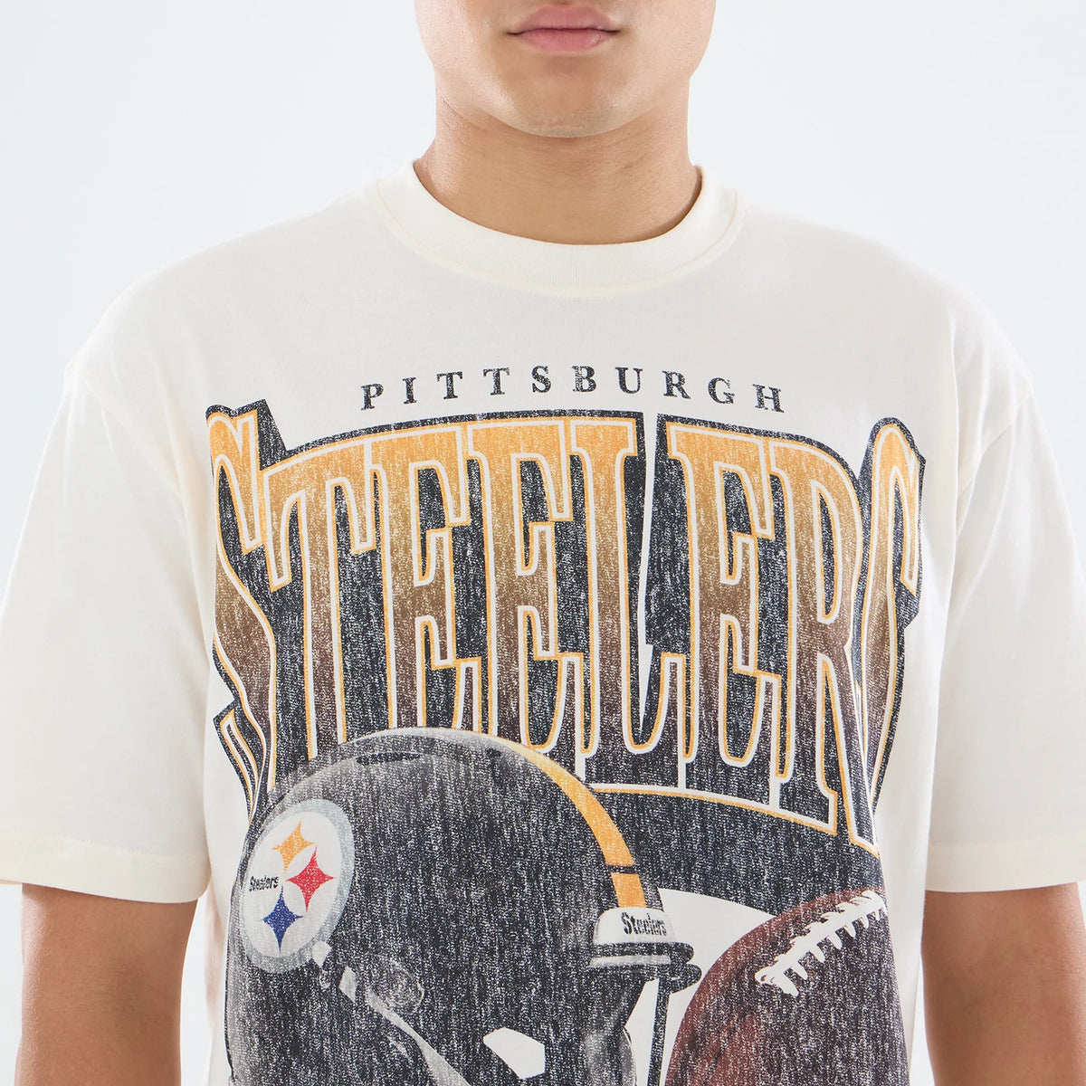 The model is wearing this NFL Sport Classic Pittsburgh Steelers T-Shirt in cream. 4