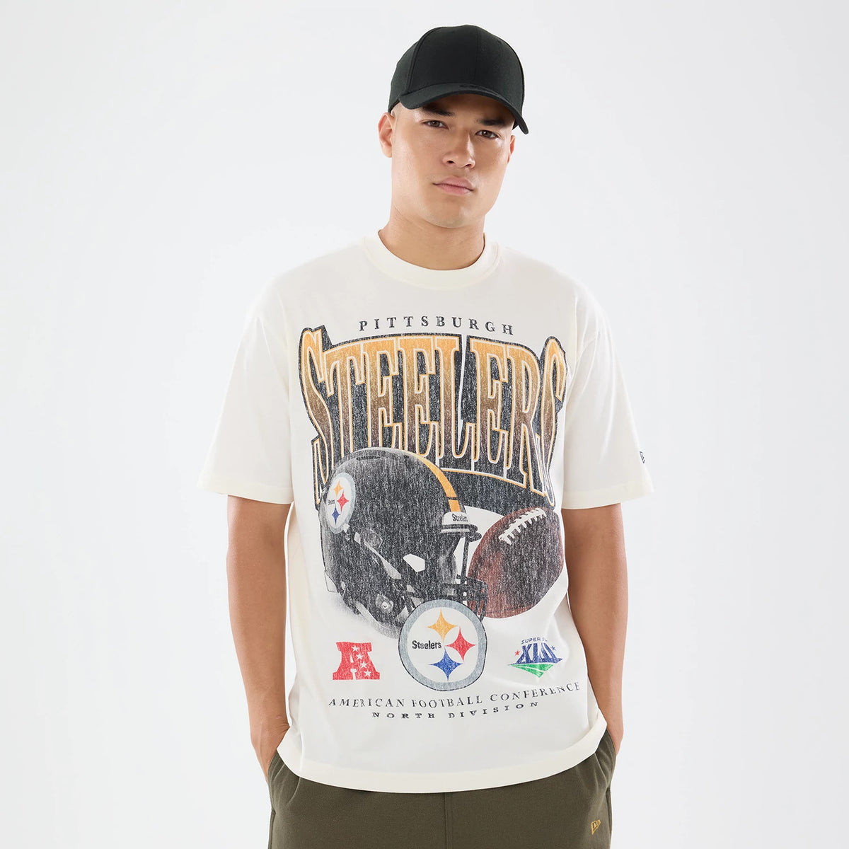 The model is wearing this NFL Sport Classic Pittsburgh Steelers T-Shirt in cream. 1