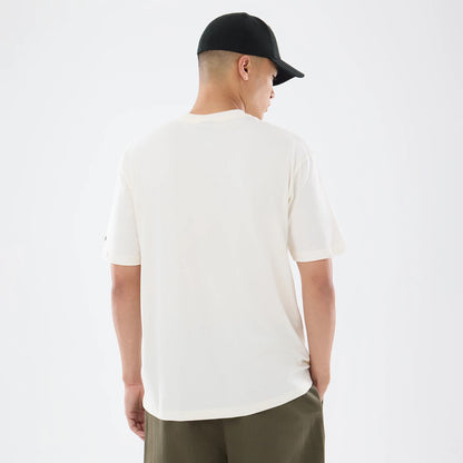 The model is wearing this NFL Sport Classic Pittsburgh Steelers T-Shirt in cream. 2