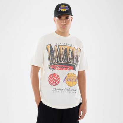 New Era LA Lakers NBA Sport Classic Cream T-Shirt, front view on-model featuring a large Lakers graphic with basketball and net on the chest, 'Lakers' lettering across the top, and paired with a black cap with an embroidered Lakers logo.