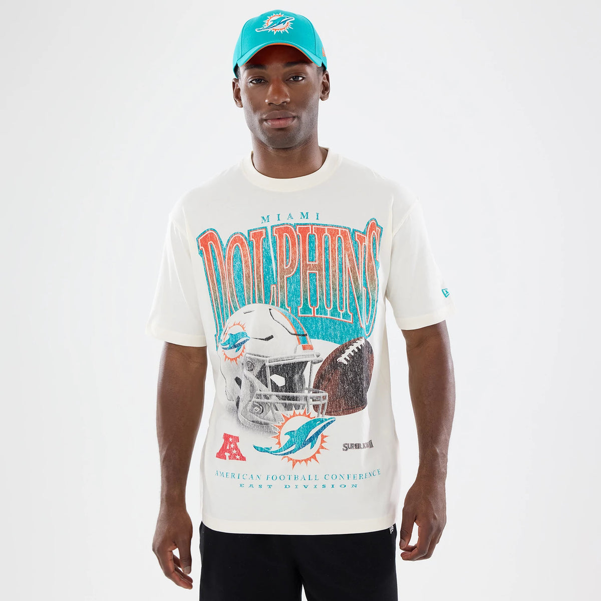 The model is wearing this NFL Sport Classic Miami Dolphins T-Shirt in cream. 1
