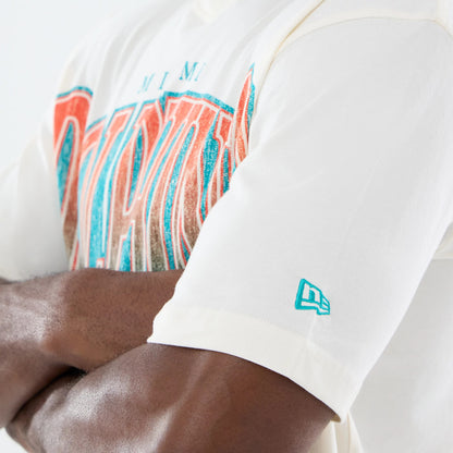 The model is wearing this NFL Sport Classic Miami Dolphins T-Shirt in cream. 5