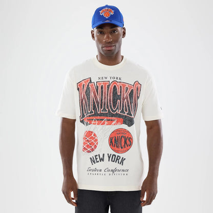 The model is wearing this NBA Sport Classic New York Knicks T-Shirt in cream. 1