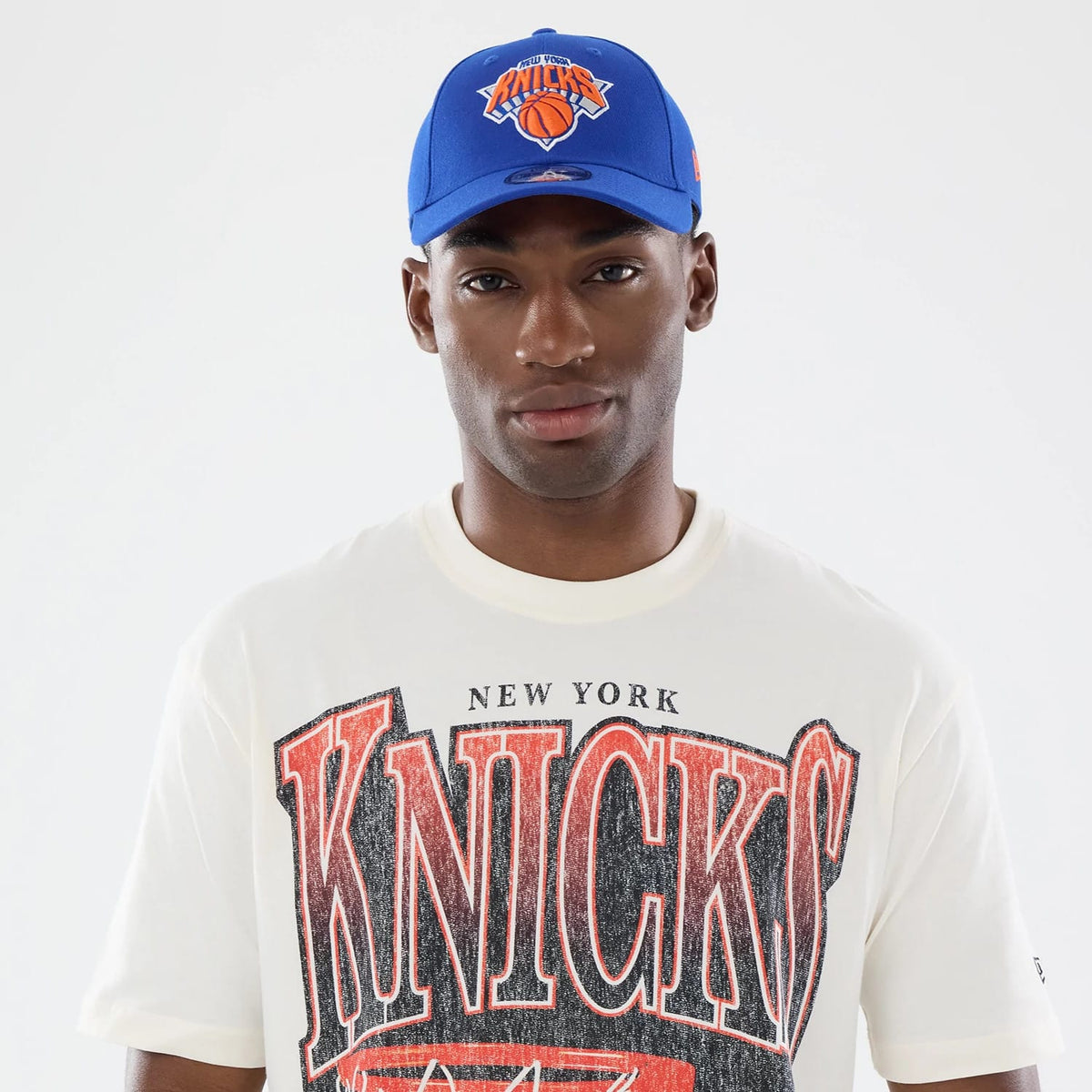 The model is wearing this NBA Sport Classic New York Knicks T-Shirt in cream. 6