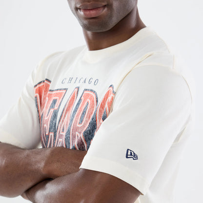 New Era Chicago Bears NFL Sport Classic Cream T-Shirt, front view on-model featuring large distressed Bears lettering in red across the chest, small Chicago text above, and a navy embroidered New Era logo on the sleeve.