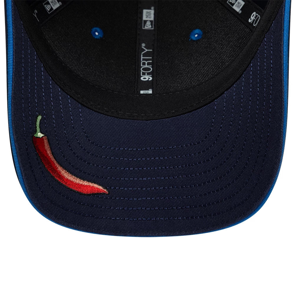Williams Carlos Sainz Navy New Era 9FORTY M-Crown Adjustable Cap, inside view showing the black sweatband, navy undervisor with a red embroidered chili pepper on the front visor and internal taping featuring 9FORTY branding.