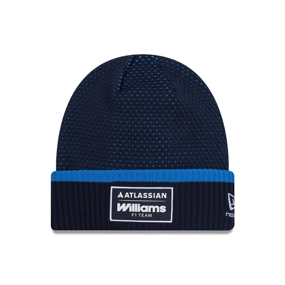 New Era Williams Team Navy Cuff Knit Beanie Hat, front view showing a navy and royal blue knitted design with an embroidered patch displaying Williams and Atlassian logos on the cuff, and the New Era flag logo on the side.