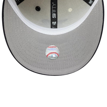 Texas Rangers MLB Pin Cream & Navy New Era 59FIFTY Fitted Cap, inside view showing grey undervisor with a baseball sticker, black taping with 59FIFTY branding, and a white sweatband along the edge of the structured crown.