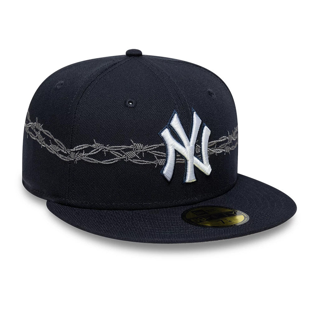 New York Yankees MLB Icon Navy New Era 59FIFTY Fitted Cap, three-quarter view showing the raised white embroidered NY logo on the front panel, a grey barbed wire pattern across the crown, and a gold 59FIFTY size sticker on the flat navy visor.