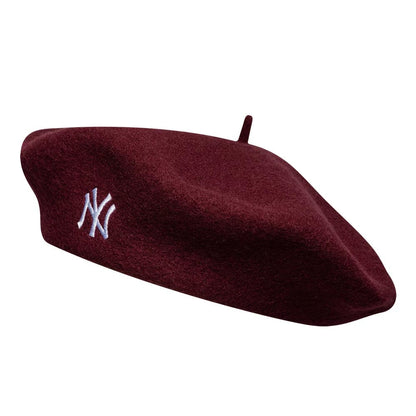 Pictured is this MLB Wool Script New York Yankees Beret in dark red. 1