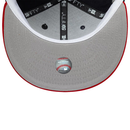 Atlanta Braves MLB Icon Navy & Red New Era 59FIFTY Fitted Cap, inside view showing grey undervisor with a baseball-themed sticker, contrasting red edge, and interior taping with 59FIFTY branding in white over a dark lining.