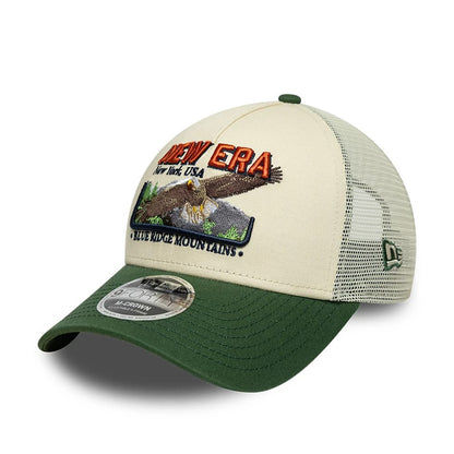 Pictured is this New Era Graphic 9FORTY M-Crown A-Frame Trucker cap in cream. 1