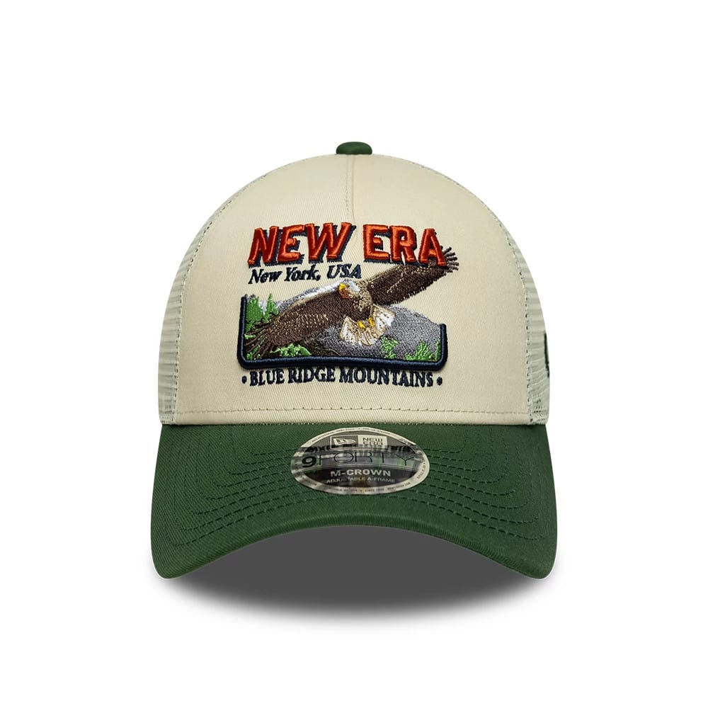Pictured is this New Era Graphic 9FORTY M-Crown A-Frame Trucker cap in cream. 2
