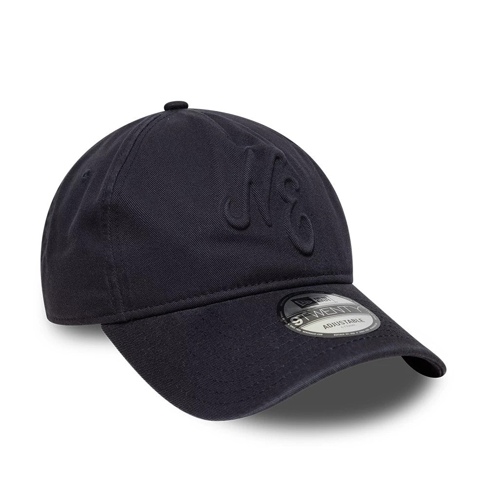 New Era Embossed Navy New Era 9TWENTY A-Frame Adjustable Cap, three-quarter view showcasing the embossed N logo on the front panel, a curved visor with a 9TWENTY size sticker, and a structured crown in a navy blue colour.