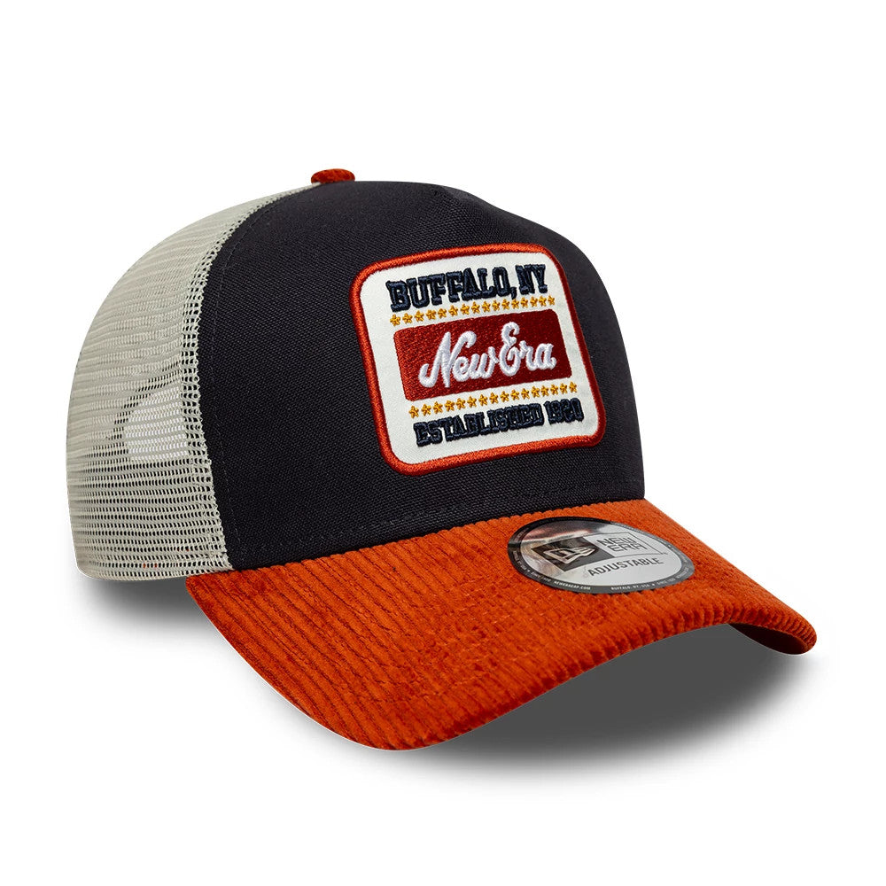 Pictured is this New Era Patch Cord 9FORTY A-Frame Trucker cap in navy & red. 3