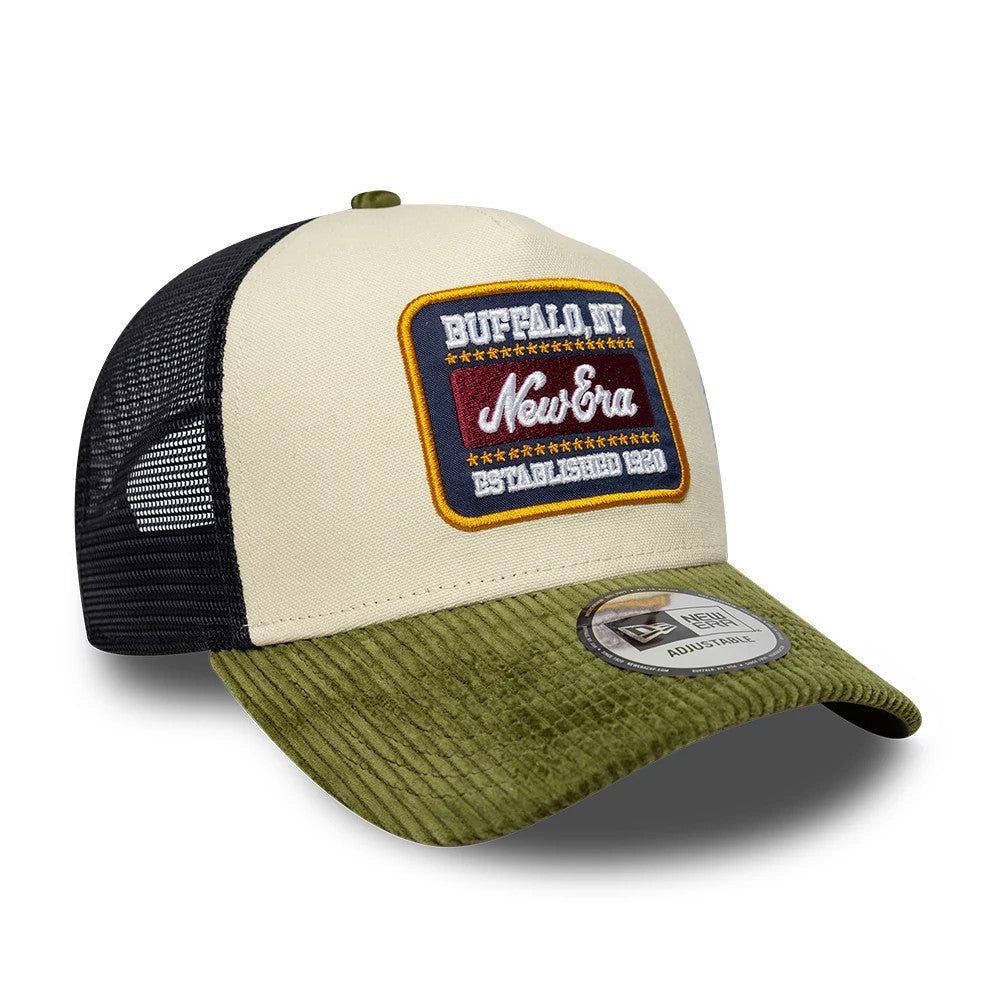 Pictured is this New Era Patch Cord 9FORTY A-Frame Trucker cap in cream & green. 3