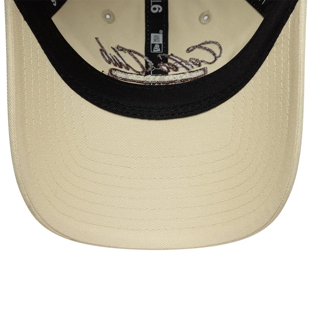 Pictured is this Womens New Era Café Slogan 9TWENTY cap in cream. 5