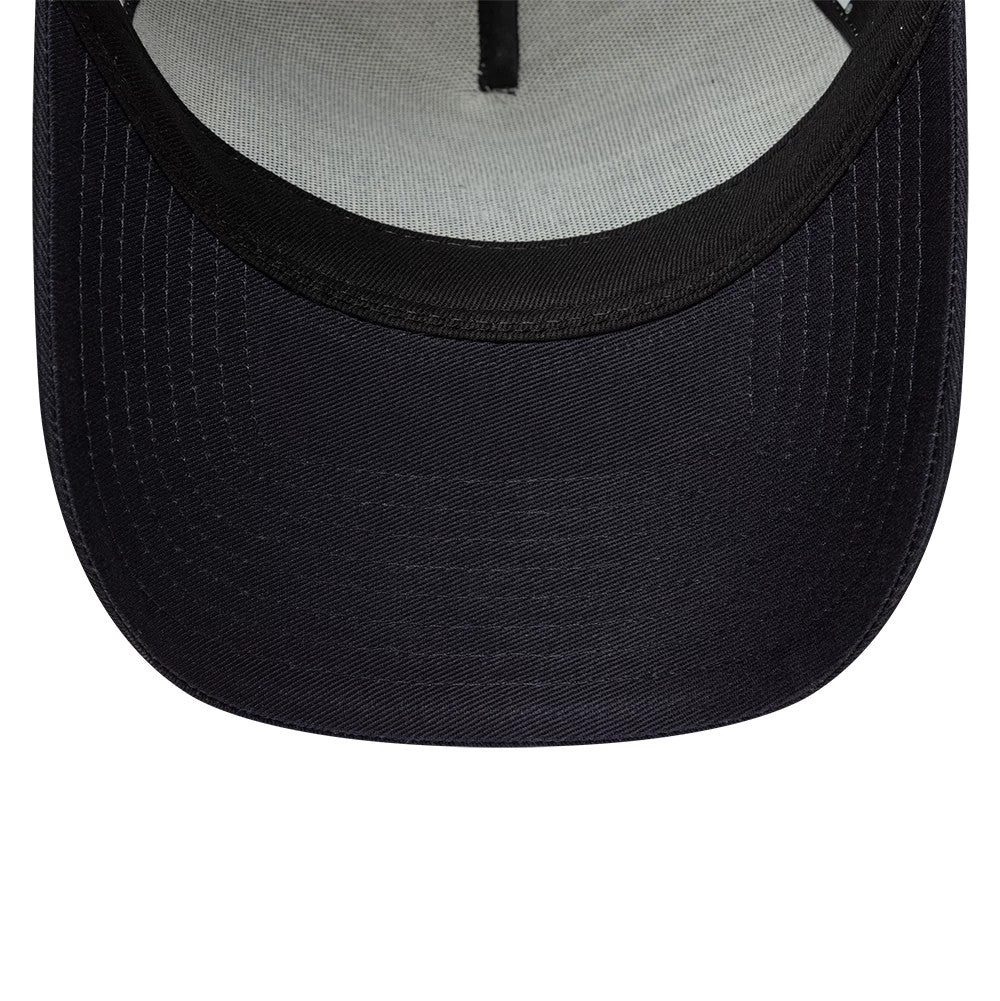 New Era Cali Licence Plate Navy 9FORTY A-Frame Trucker Adjustable Cap, inside view showing a grey sweatband, black undervisor, and contrasting internal taping, highlighting the structured design of the navy cap's crown.
