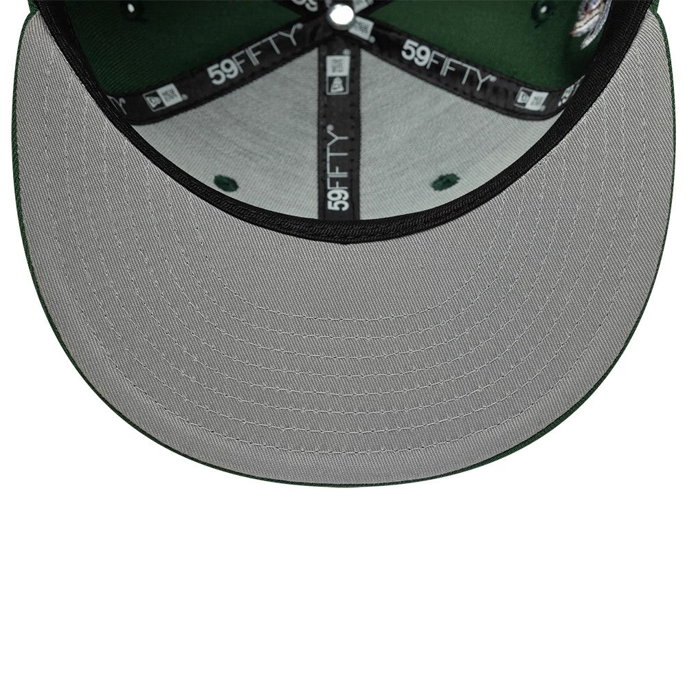 New Era Heritage Script Dark Green 59FIFTY Fitted Cap, inside view showing the grey undervisor with white stitching, black taping with white 59FIFTY lettering, and a dark green sweatband on the structured crown.