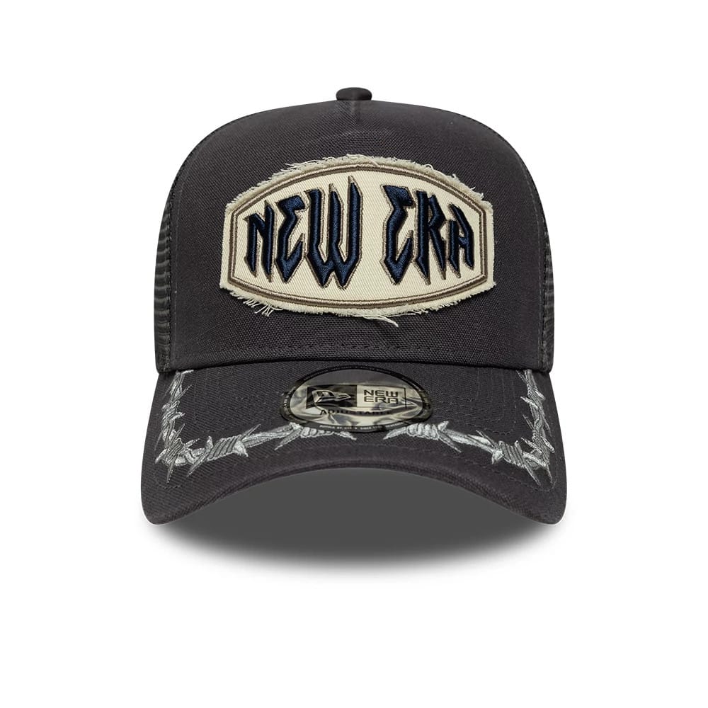 Pictured is this New Era Distressed Patch 9FORTY E-Frame Trucker cap in charcoal. 2