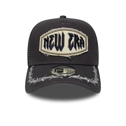 Pictured is this New Era Distressed Patch 9FORTY E-Frame Trucker cap in charcoal. 2
