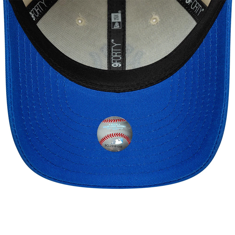 Youth Yankees MLB League Essential Cream & Blue New Era 9FORTY Adjustable Cap, inside view showing the black sweatband with white New Era and 9FORTY logos on the taping, a black undervisor, and the holographic baseball sticker on the blue visor.