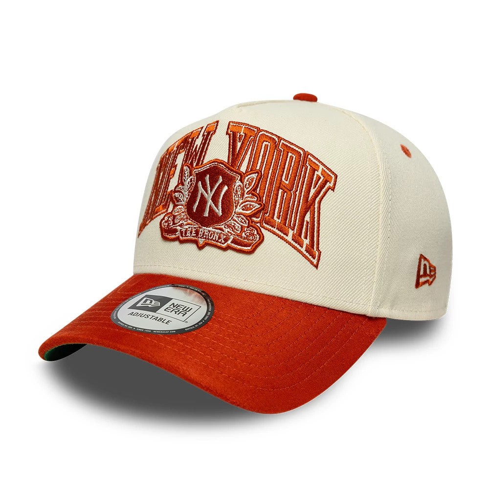 New York Yankees MLB Suede Cream & Orange New Era 9FORTY E-Frame Adjustable Cap, three-quarter view showing the orange New York raised embroidery on the cream front panel, an orange visor with a New Era 9FORTY size sticker.