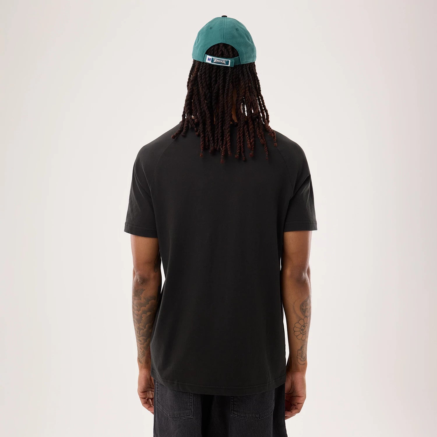 The model is wearing this NFL Sideline 2026 Philadelphia Eagles T-Shirt in black. 2