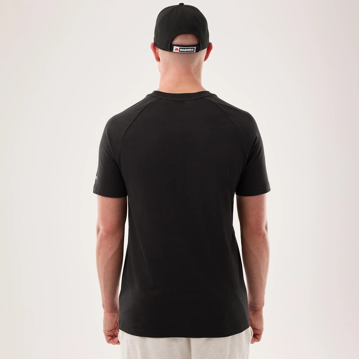 The model is wearing this NFL Sideline 2026 Las Vegas Raiders T-Shirt in black. 2