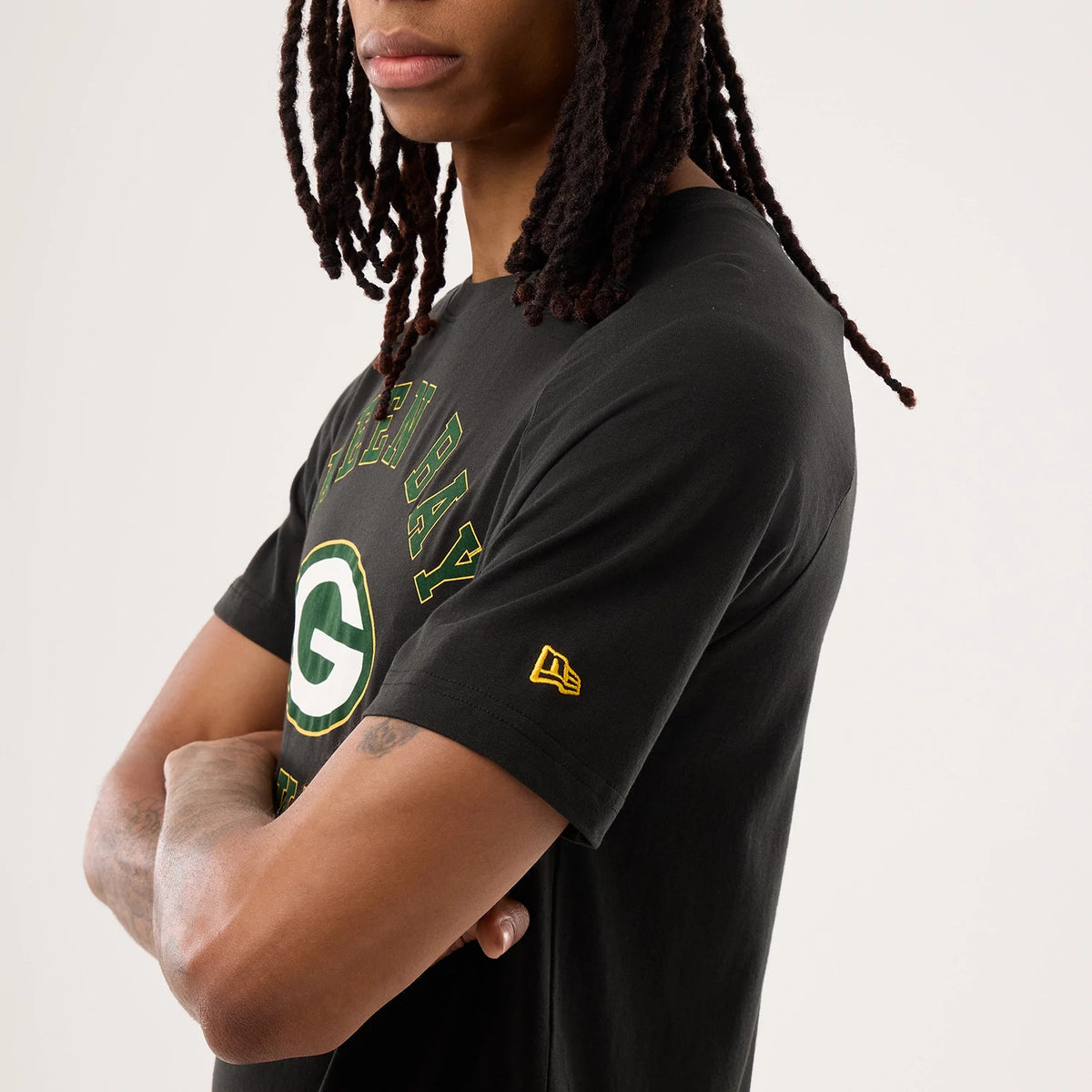 The model is wearing this NFL Sideline 2026 Green Bay Packers T-Shirt in black. 6