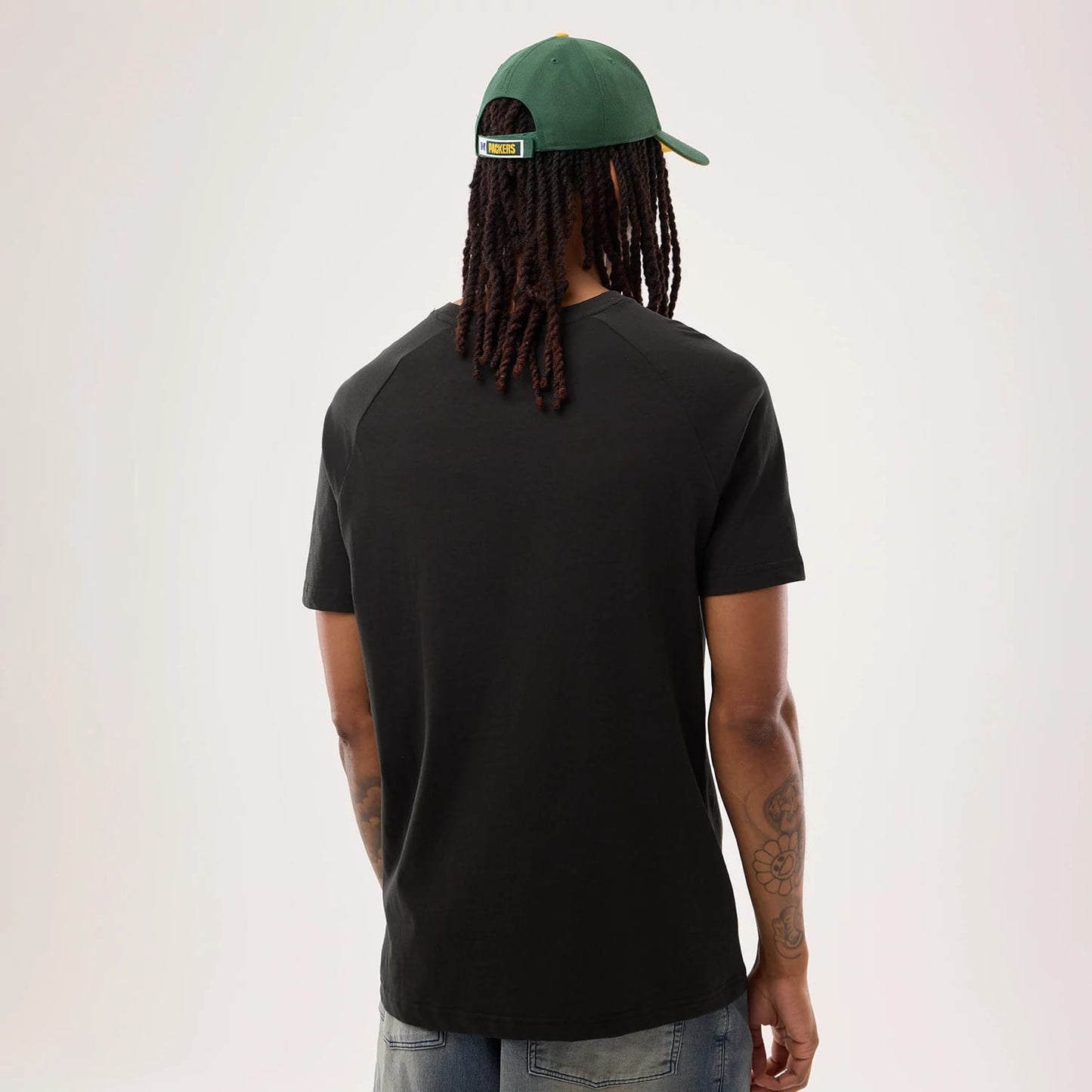 The model is wearing this NFL Sideline 2026 Green Bay Packers T-Shirt in black. 2
