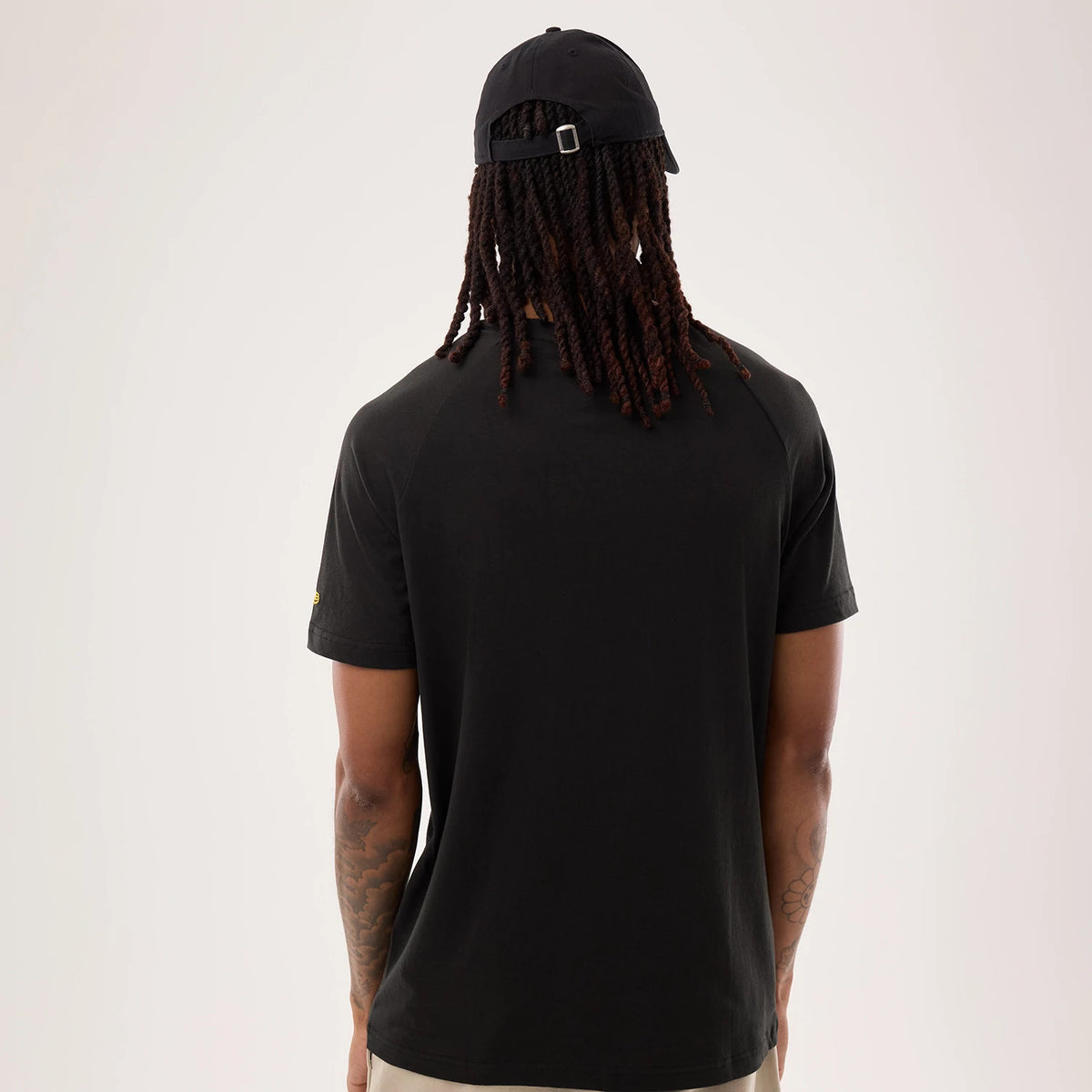 The model is wearing this NFL Sideline 2026 Pittsburgh Steelers T-Shirt in black. 2