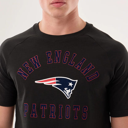 The model is wearing this NFL Sideline 2026 New England Patriots T-Shirt in black. 4